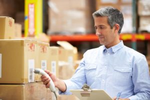 worker scanning package in warehouse