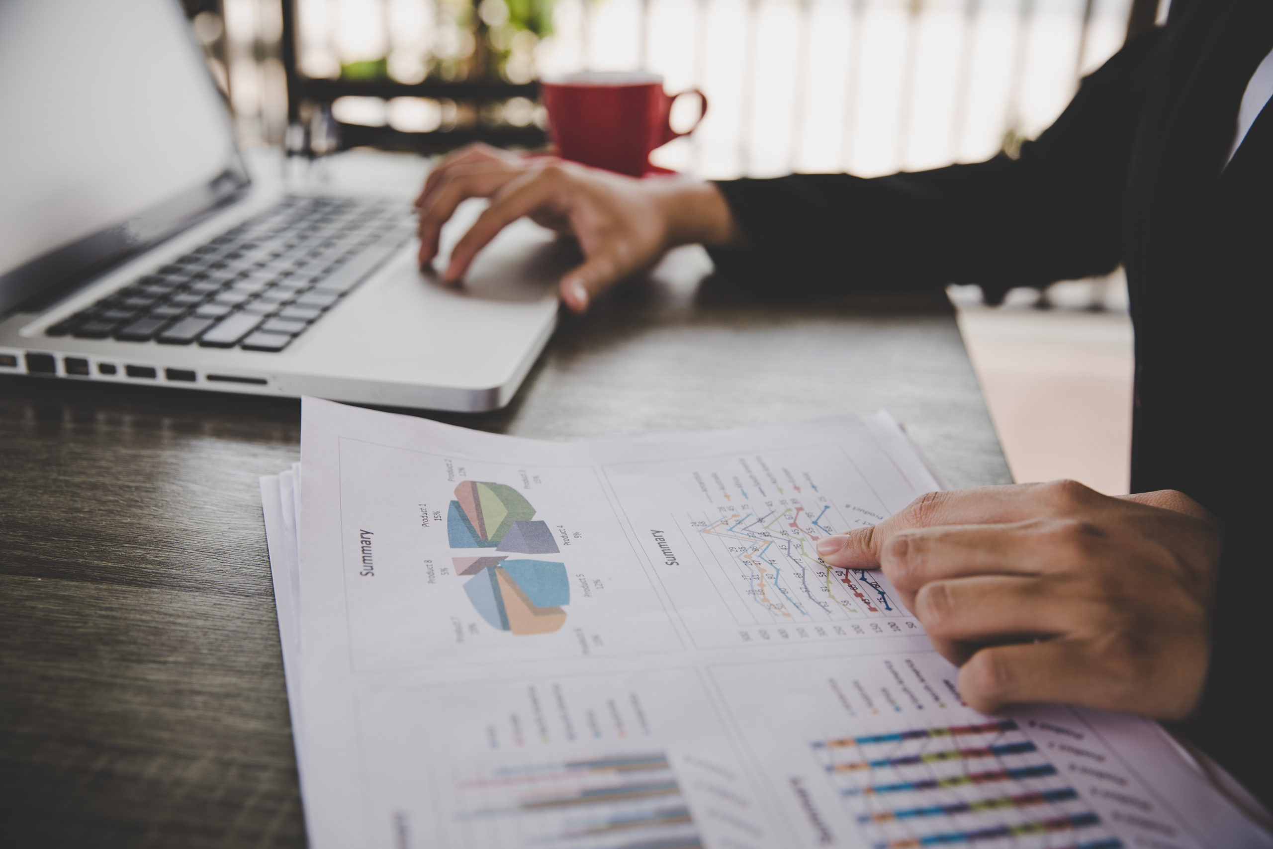 businesswoman sitting desk work with financial documents company scaled
